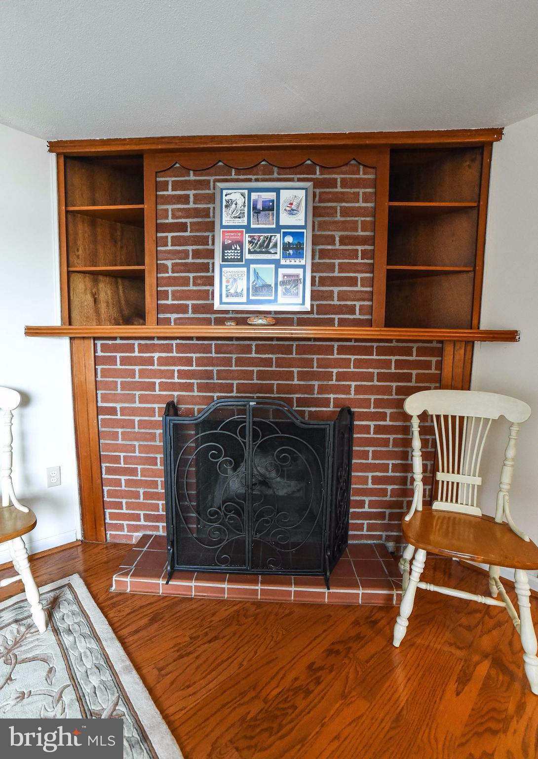 16215 Osprey Cove Ln Ridge Ridge, MD 20680 - Photo 20 of 30 a view of a livingroom with furniture and an empty fireplace