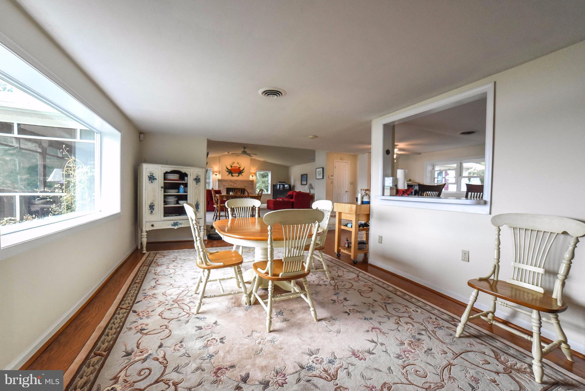 16215 Osprey Cove Ln Ridge Ridge, MD 20680 - Photo 21 of 30 a dining room with furniture and window