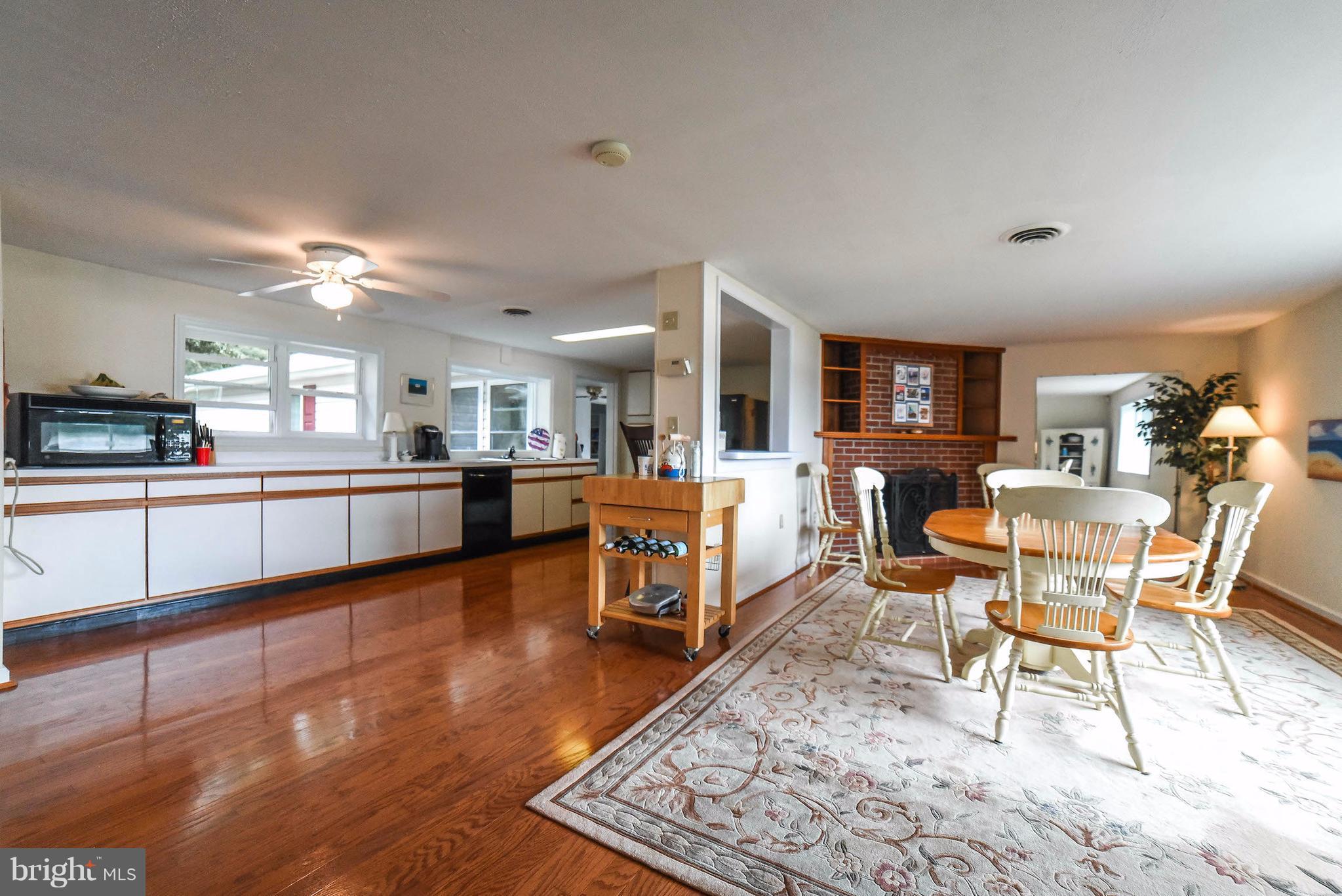 16215 Osprey Cove Ln Ridge Ridge, MD 20680 - Photo 22 of 30 a living room with furniture and a view of kitchen