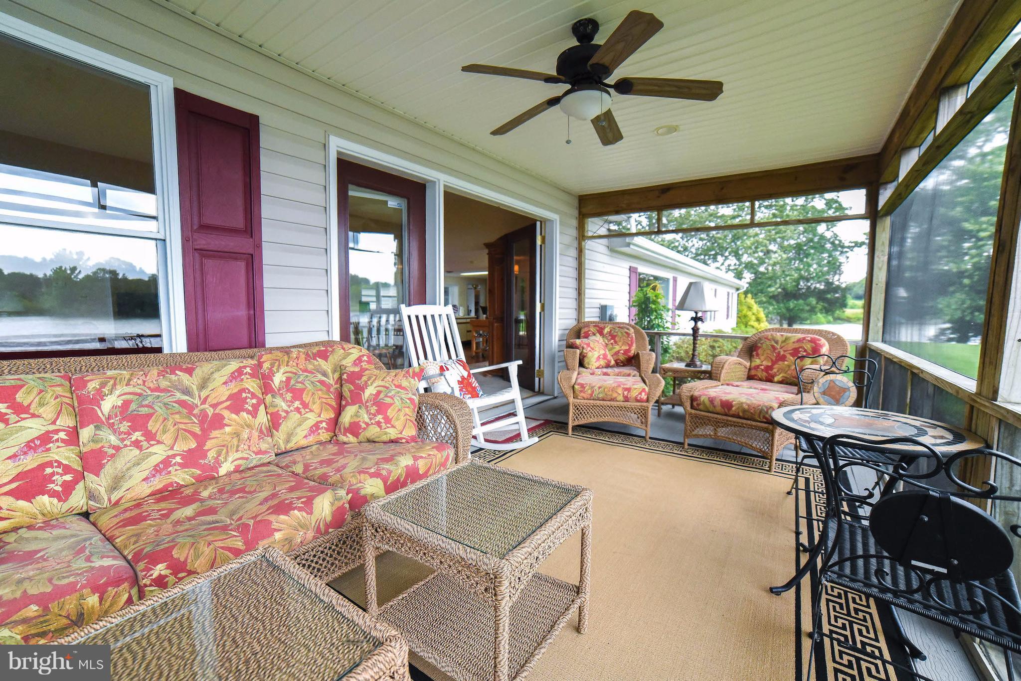 16215 Osprey Cove Ln Ridge Ridge, MD 20680 - Photo 28 of 30 a bedroom with furniture and a large window