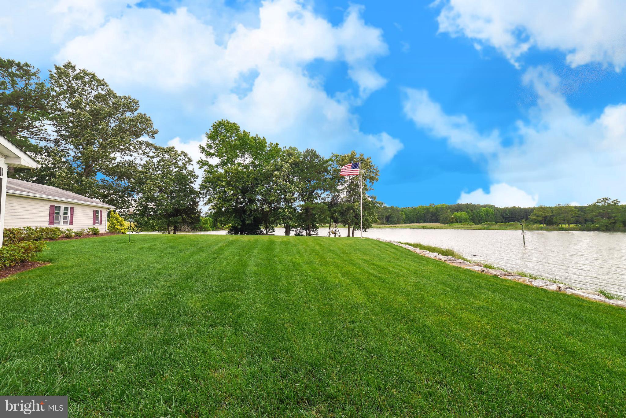 16215 Osprey Cove Ln Ridge Ridge, MD 20680 - Photo 4 of 30 a view of a house with a yard