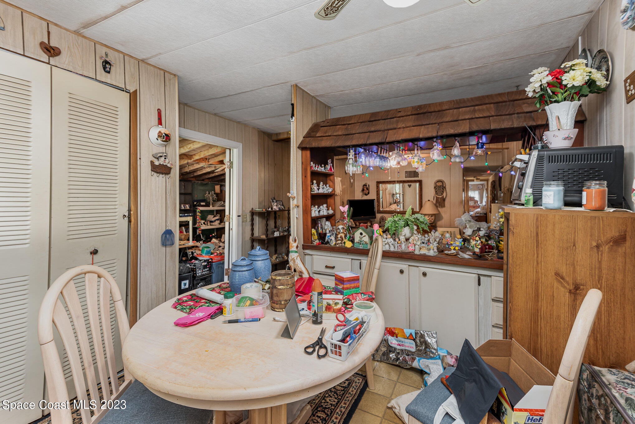 4173 Aurantia Road Mims, FL 32754 - Photo 11 of 23 a view of a dining room with furniture and chandelier