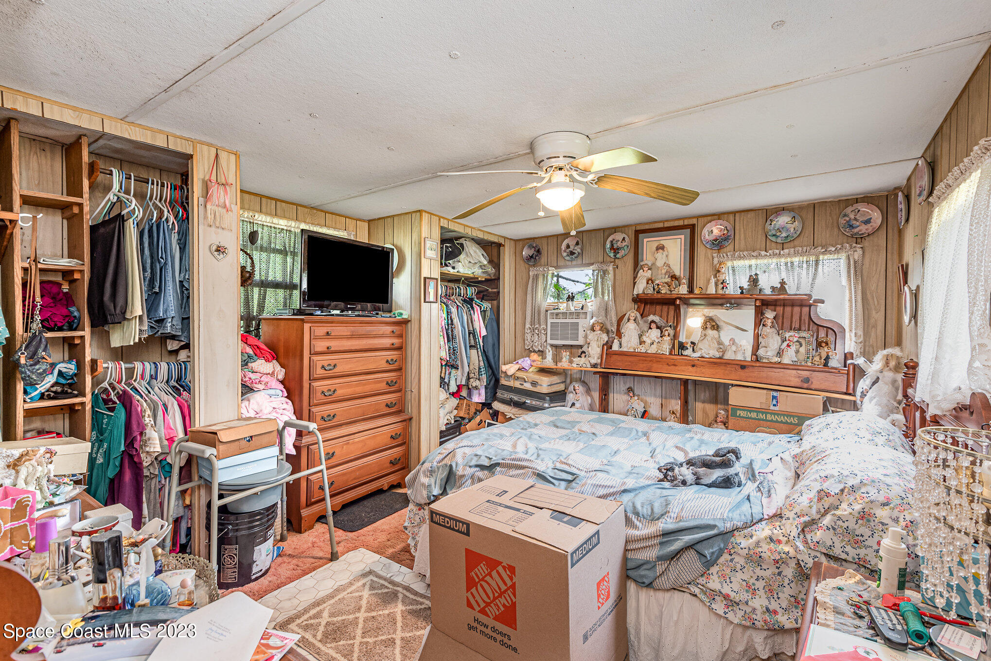4173 Aurantia Road Mims, FL 32754 - Photo 14 of 23 a living room with lots of furniture and a flat screen tv
