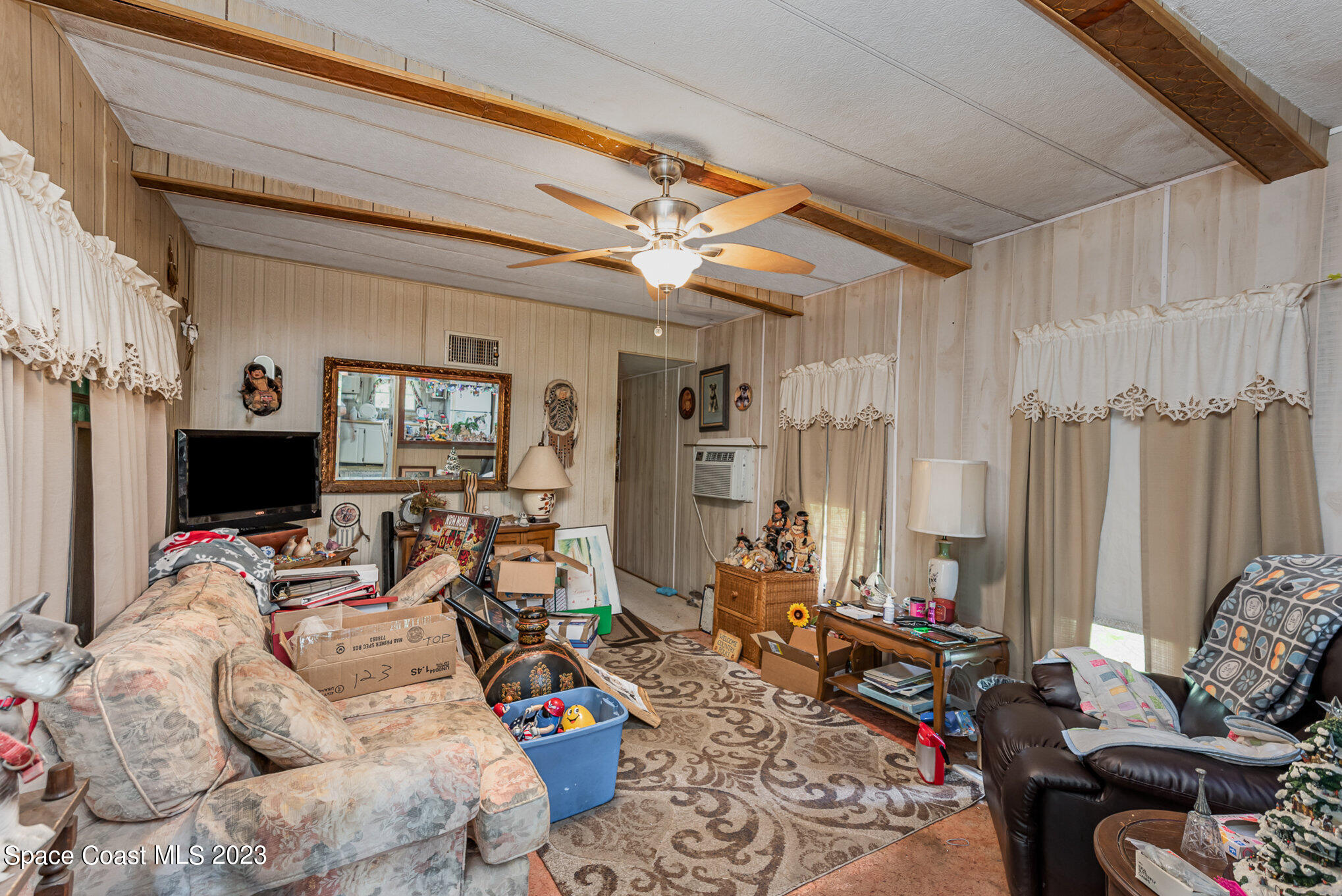 4173 Aurantia Road Mims, FL 32754 - Photo 6 of 23 a living room with furniture and a flat screen tv