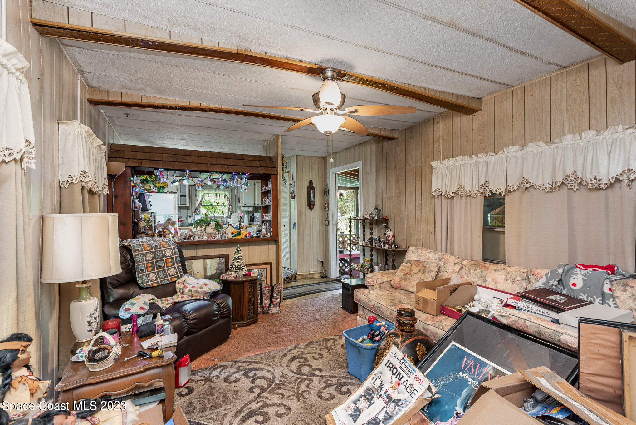 4173 Aurantia Road Mims, FL 32754 - Photo 8 of 23 a room with furniture or couch and a chandelier