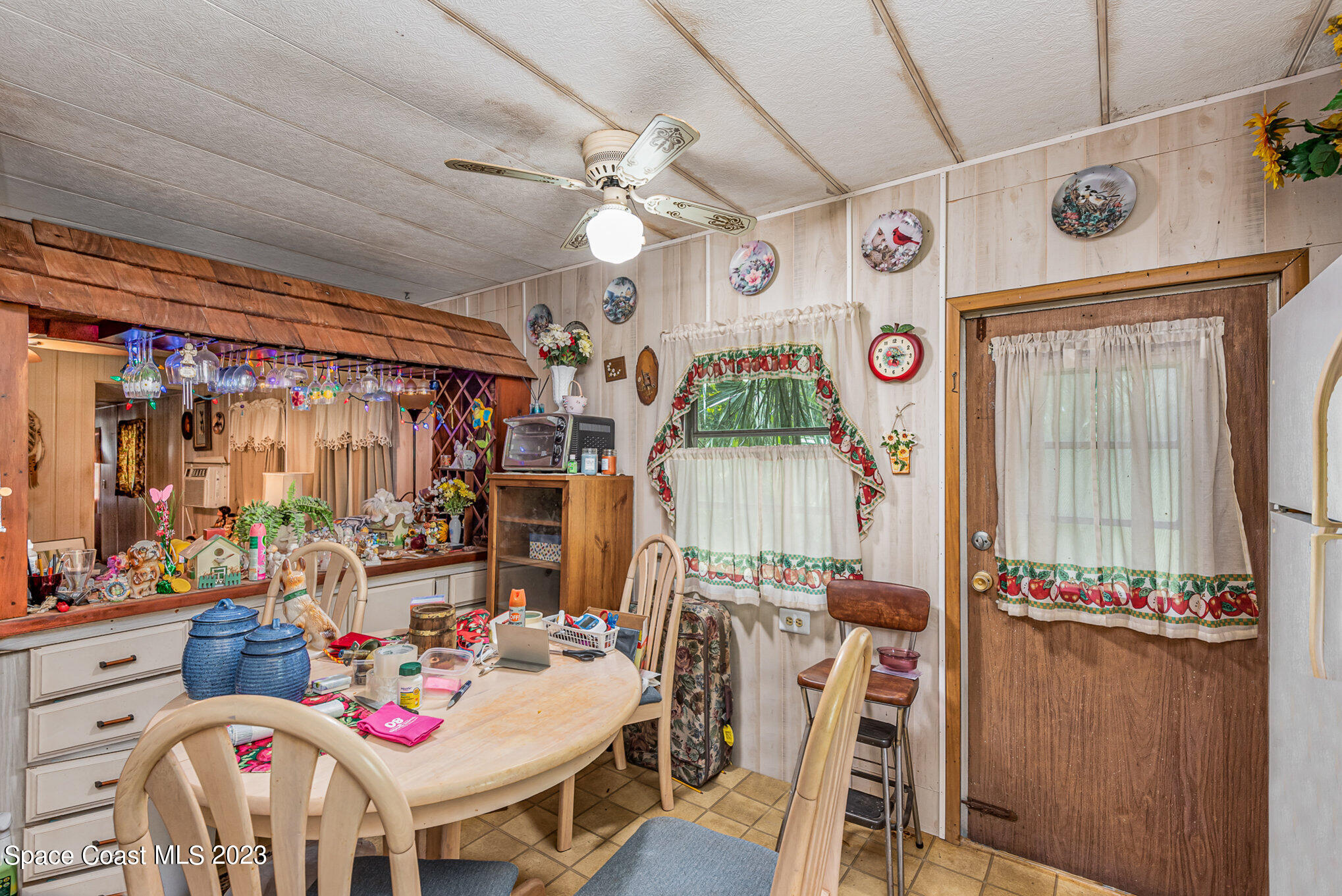 4173 Aurantia Road Mims, FL 32754 - Photo 10 of 23 a bedroom with furniture a chandelier and a window