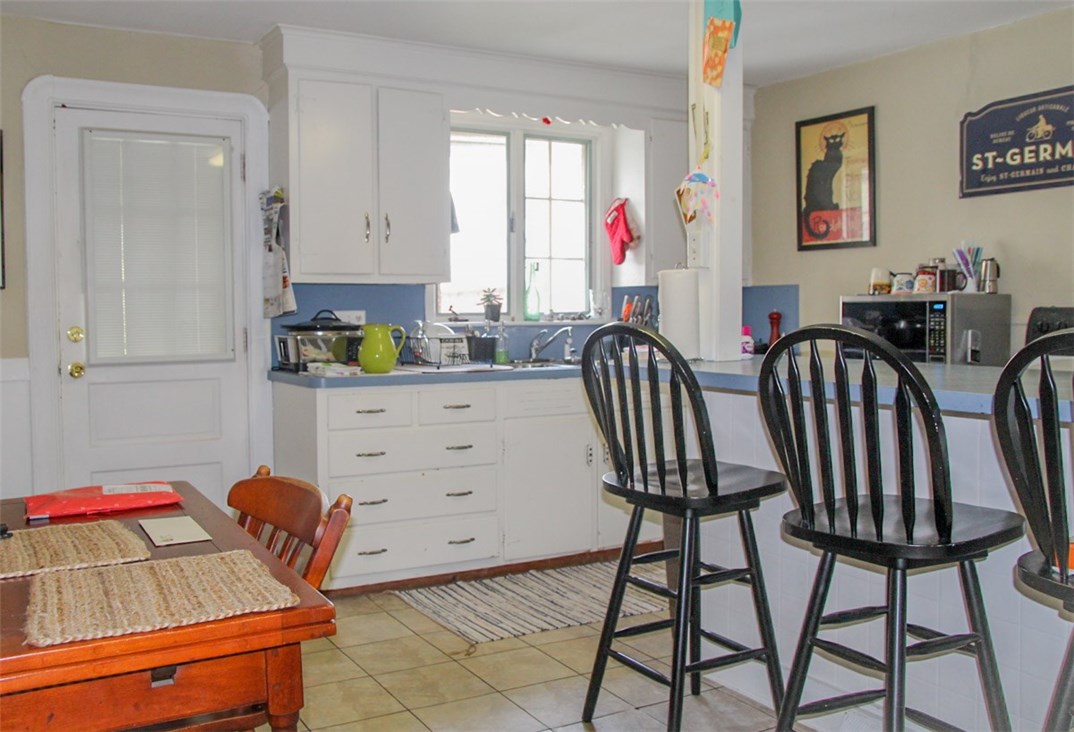 27 State Street Warren, RI 02885 - Photo 5 of 10 Woodwork, including lovely molding, continues into the spacious Kitchen.