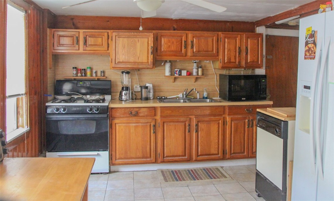 27 State Street Warren, RI 02885 - Photo 6 of 10 Another kitchen with ample cabinetry.