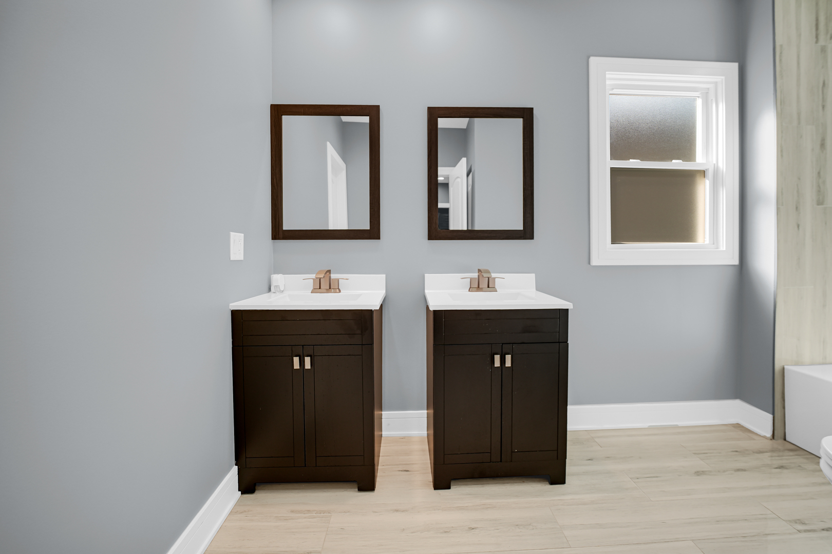 1707 East 83rd Street Chicago, IL 60617 - Photo 6 of 8 a bathroom with a sink and a mirror