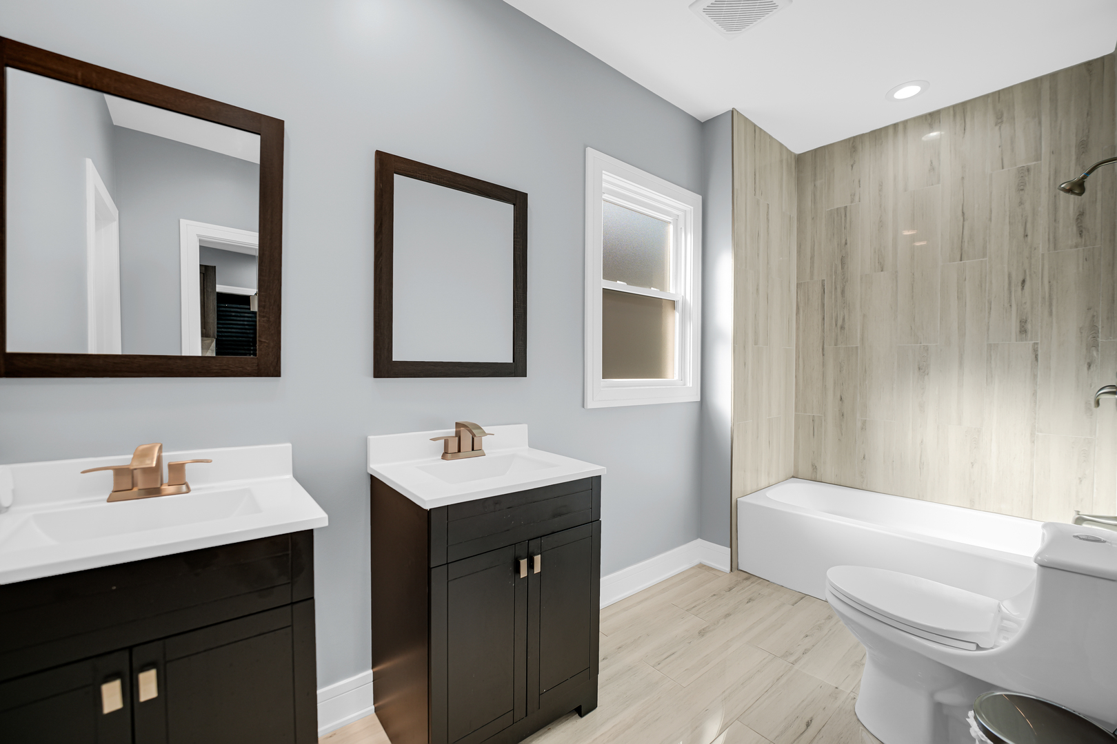 1707 East 83rd Street Chicago, IL 60617 - Photo 7 of 8 a bathroom with a sink a toilet and mirror