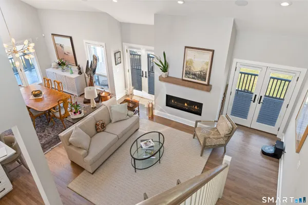 a living room with furniture a window and a table