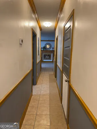 a view of a hallway with a furniture