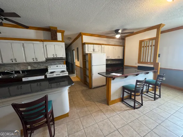 a kitchen with stainless steel appliances a sink and a stove