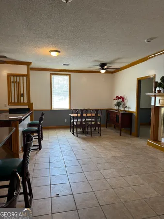 a room with gym equipment and a window
