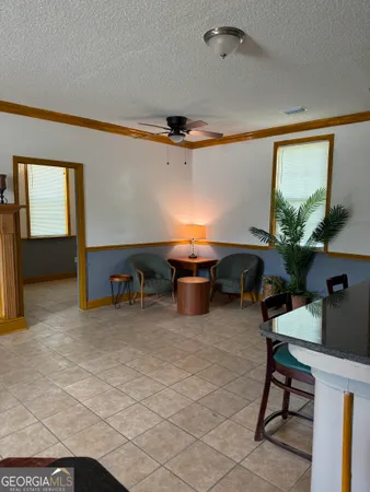 a room with furniture a air conditioner and a window