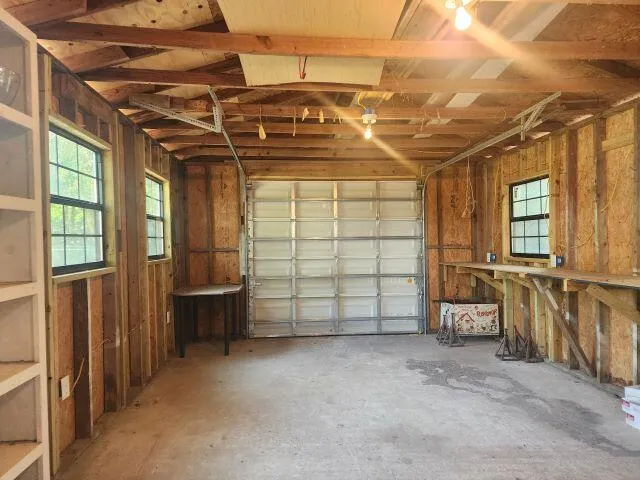 a view of a garage with wooden floors