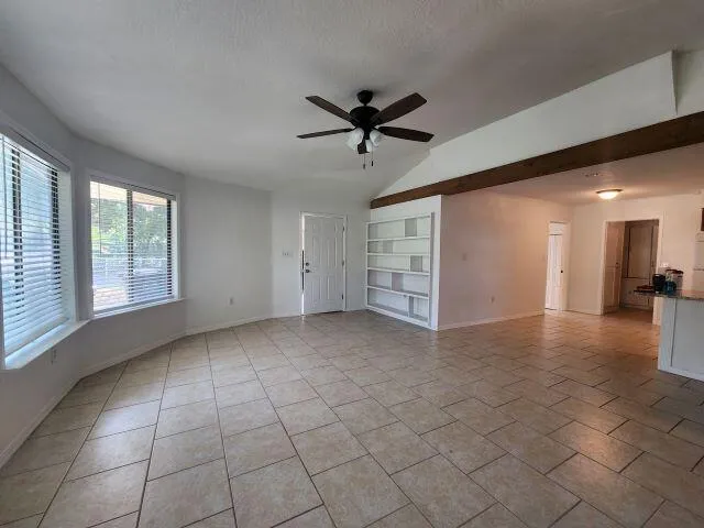 a view of a livingroom with a stove and furniture