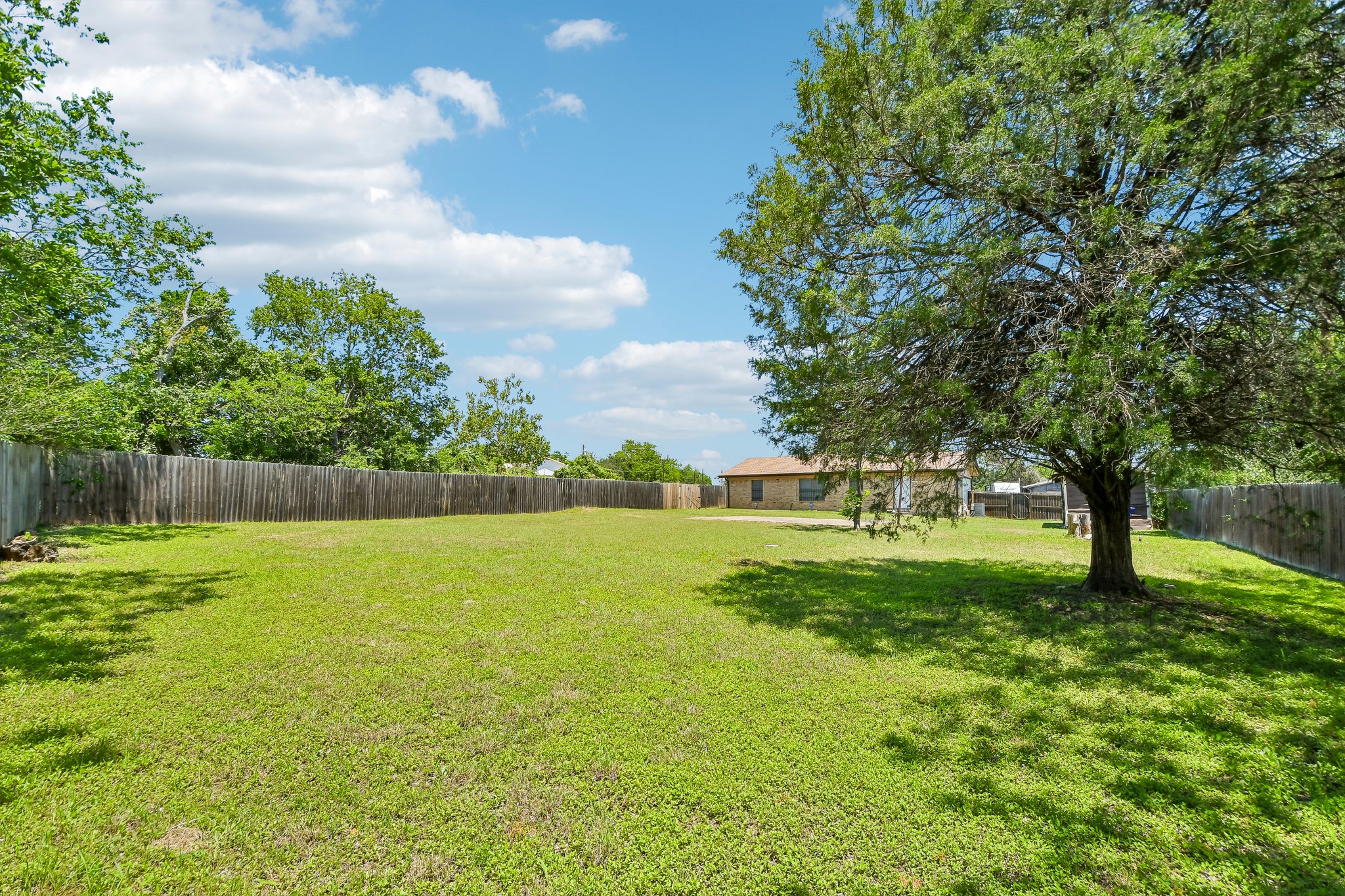 101 Brown Street Elgin, TX 78621 - Photo 31 of 32 a view of outdoor space with deck and yard