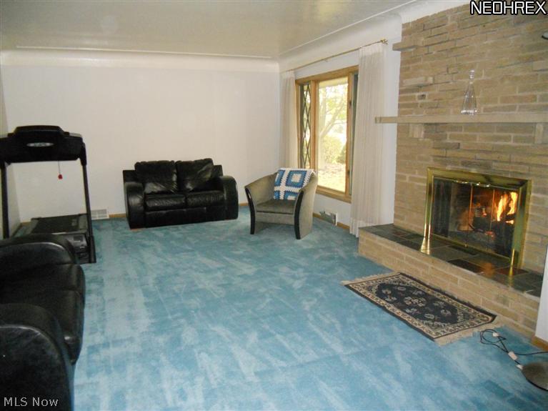 5319 Brainard Road Solon, OH 44139 - Photo 3 of 17 Living Room with Brick Feature Wall and Gas Fireplace