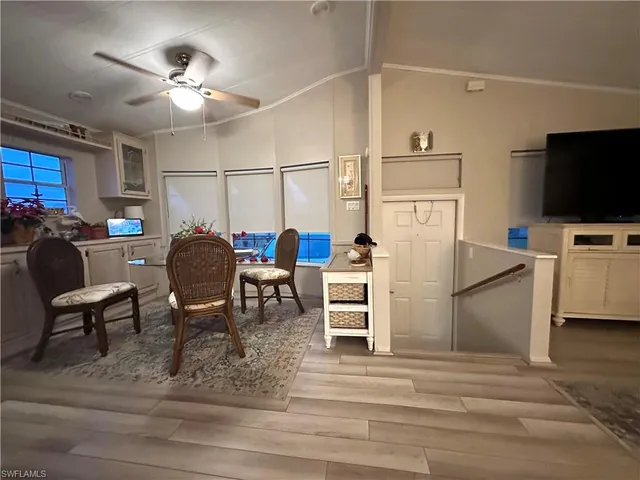 a room with furniture and a flat screen tv