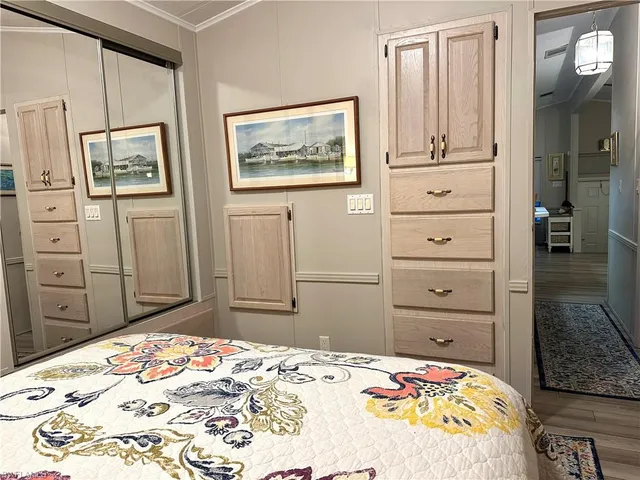 a bedroom with a bed and a cabinets