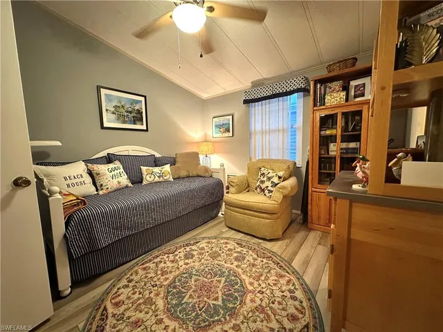 a bedroom with furniture and a rug