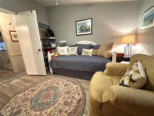 a bedroom with two beds and a couch