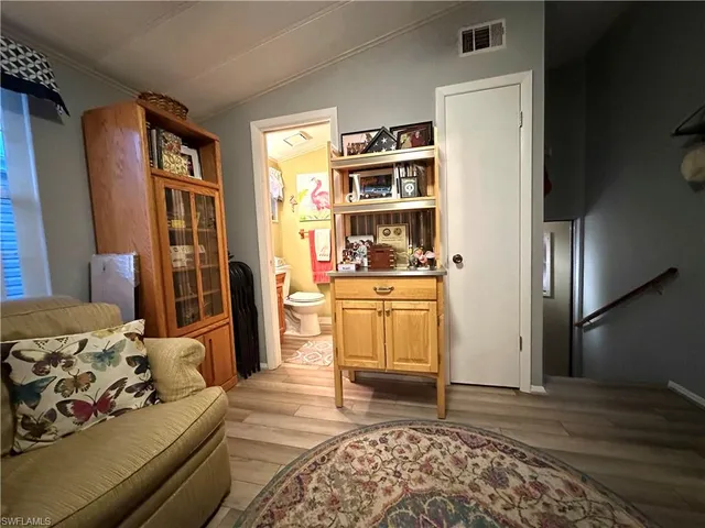 a room with a bed and closet