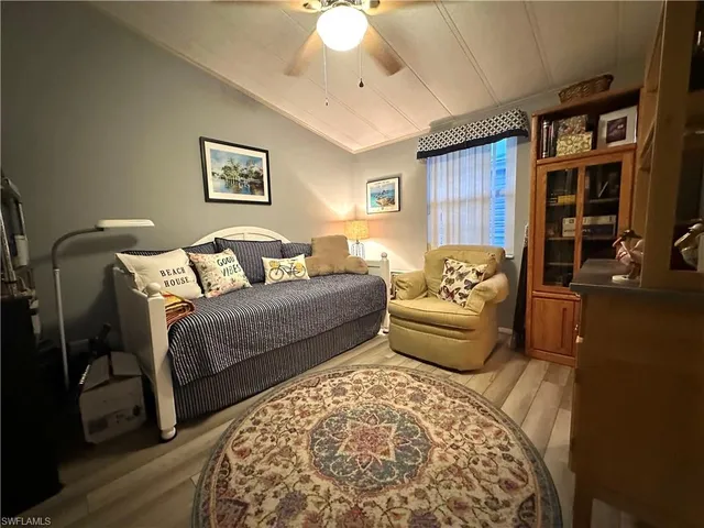 a bedroom with a bed furniture and a rug