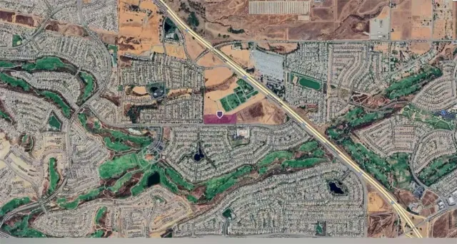 a view of a oven with white cabinets