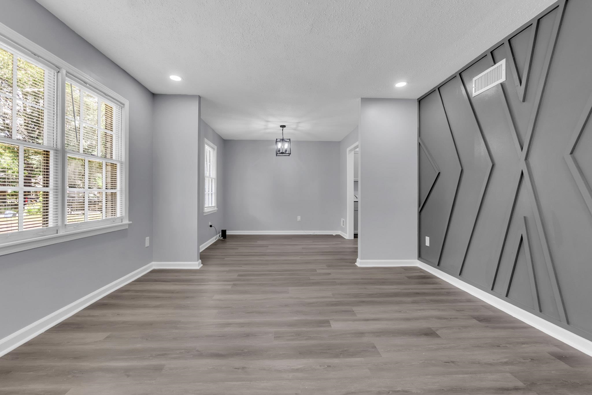 3314 Bright Ridge Cove Memphis, TN 38115 - Photo 5 of 16 Spacious room featuring wood-finish flooring, recessed lighting, and a decorative accent wall