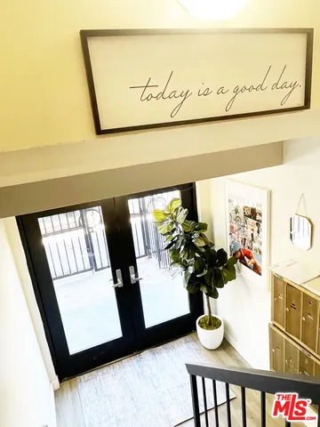 a view of flowerpot sitting in hallway
