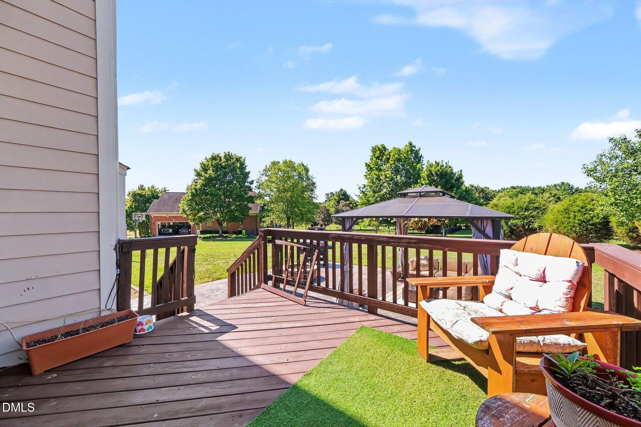 4000 Banks Stone Drive Raleigh, NC 27603 - Photo 39 of 60 a view of a patio with a table and chairs