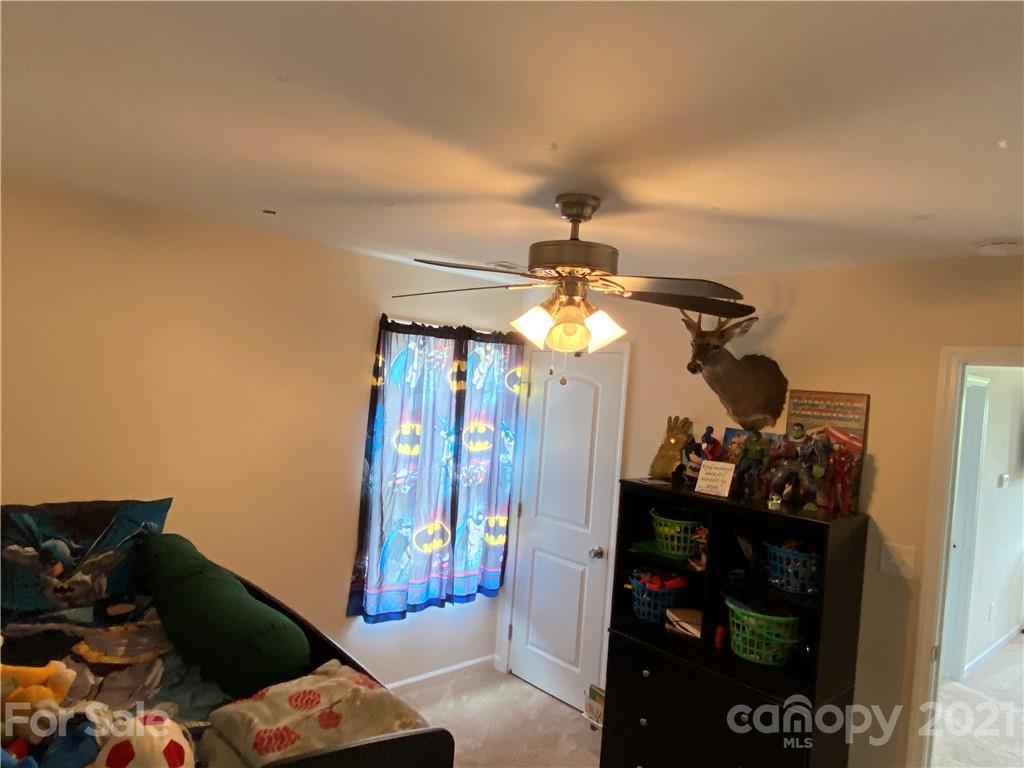 7300 Dan Rhyne Road Vale, NC 28168 - Photo 14 of 23 a bedroom with a bed and a chandelier