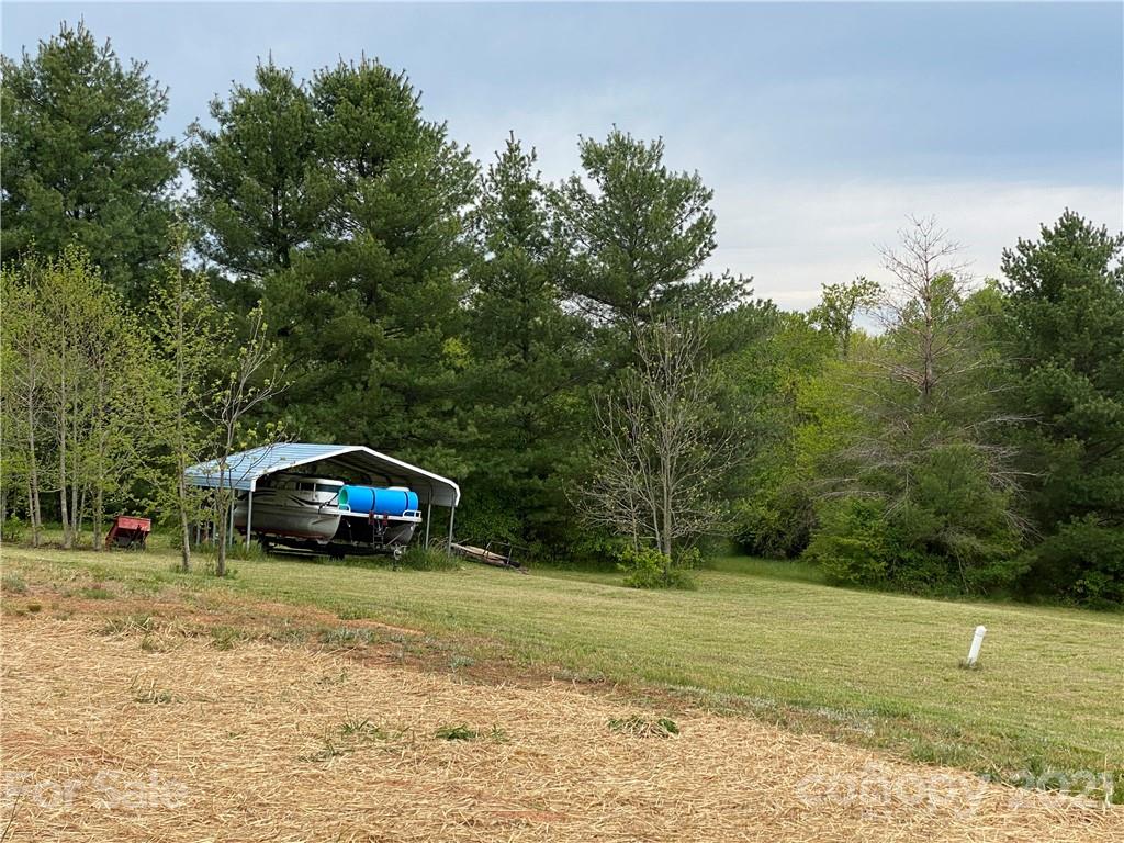 7300 Dan Rhyne Road Vale, NC 28168 - Photo 18 of 23 a view of a car is parked in the yard with large trees