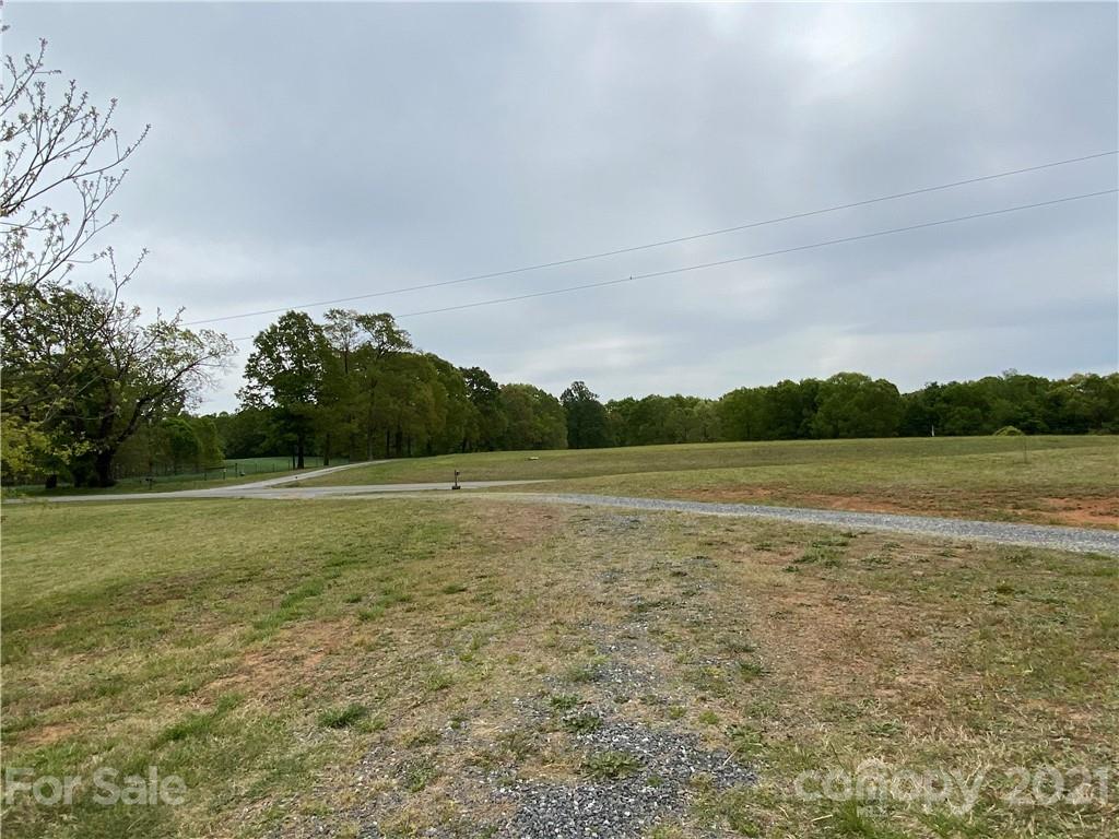 7300 Dan Rhyne Road Vale, NC 28168 - Photo 19 of 23 a view of a field with trees in the background