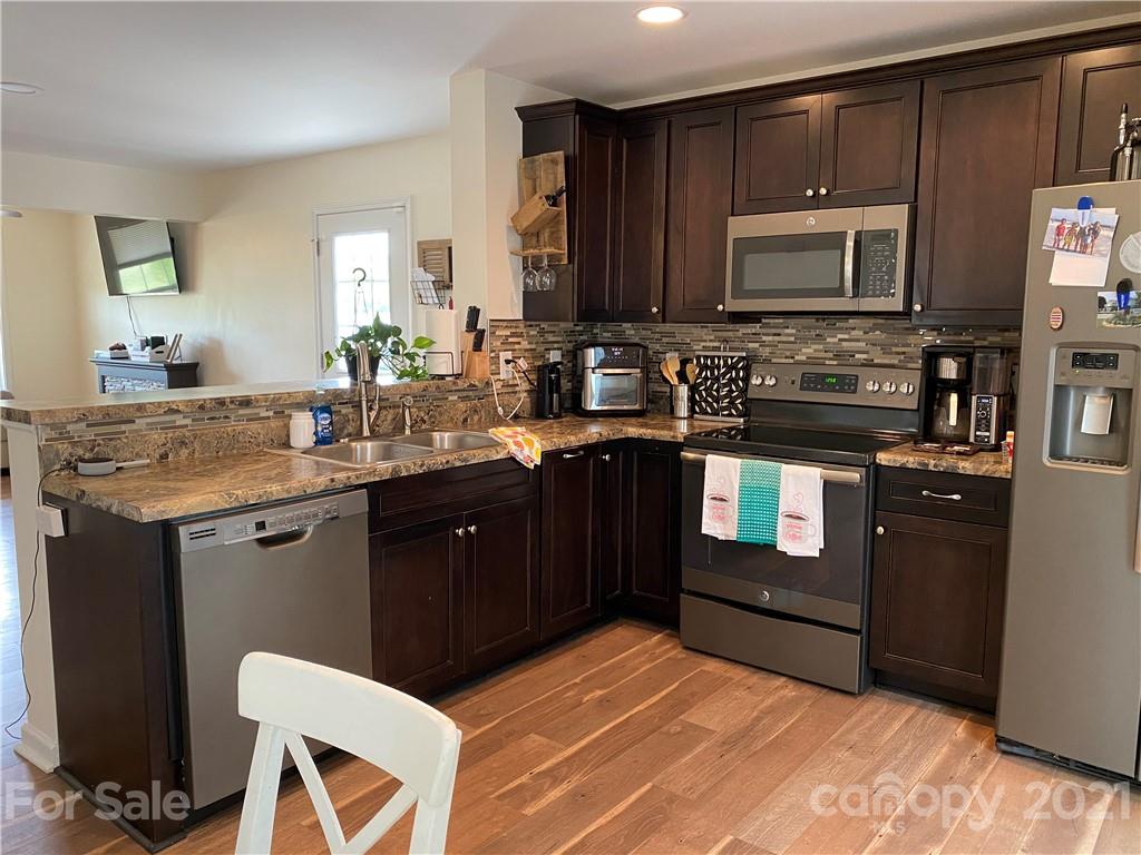 7300 Dan Rhyne Road Vale, NC 28168 - Photo 5 of 23 a kitchen with a sink stove and microwave
