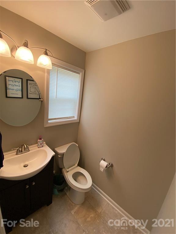 7300 Dan Rhyne Road Vale, NC 28168 - Photo 8 of 23 a bathroom with a toilet a sink and mirror