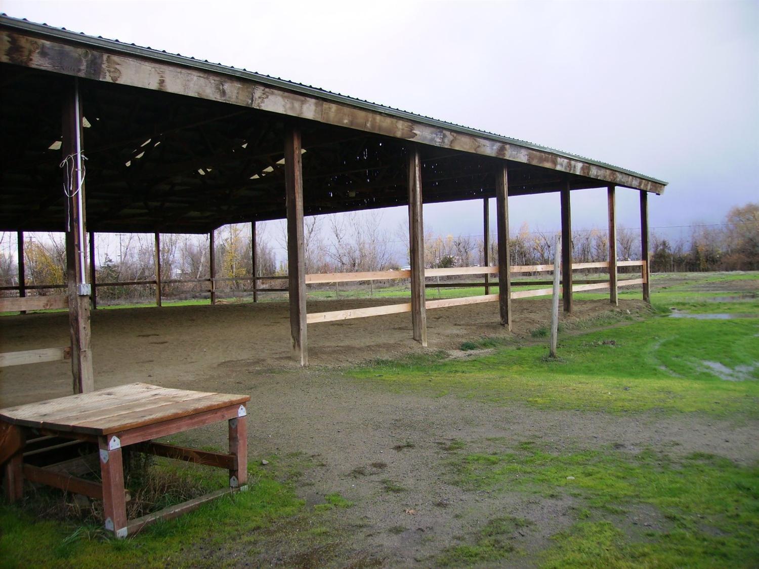 404 Bigham Brown Road Eagle Point, OR 97524 - Photo 2 of 17 a backyard of a house with table and chairs