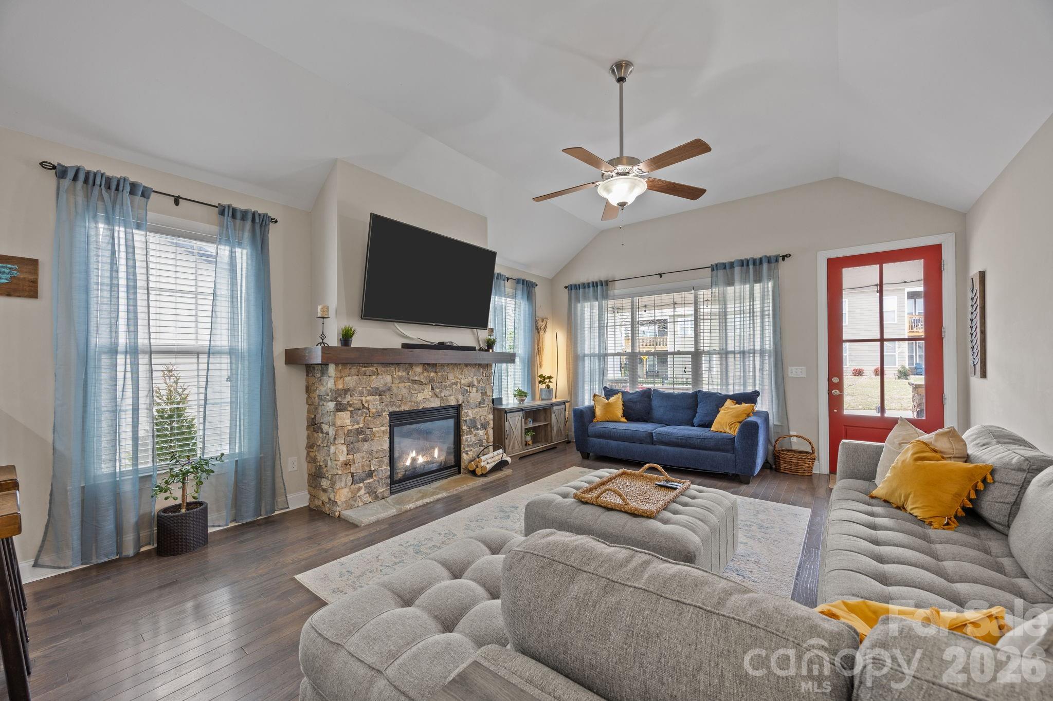 3 Dreambird Road Leicester, NC 28748 - Photo 13 of 48 a living room with furniture a fireplace and a flat screen tv