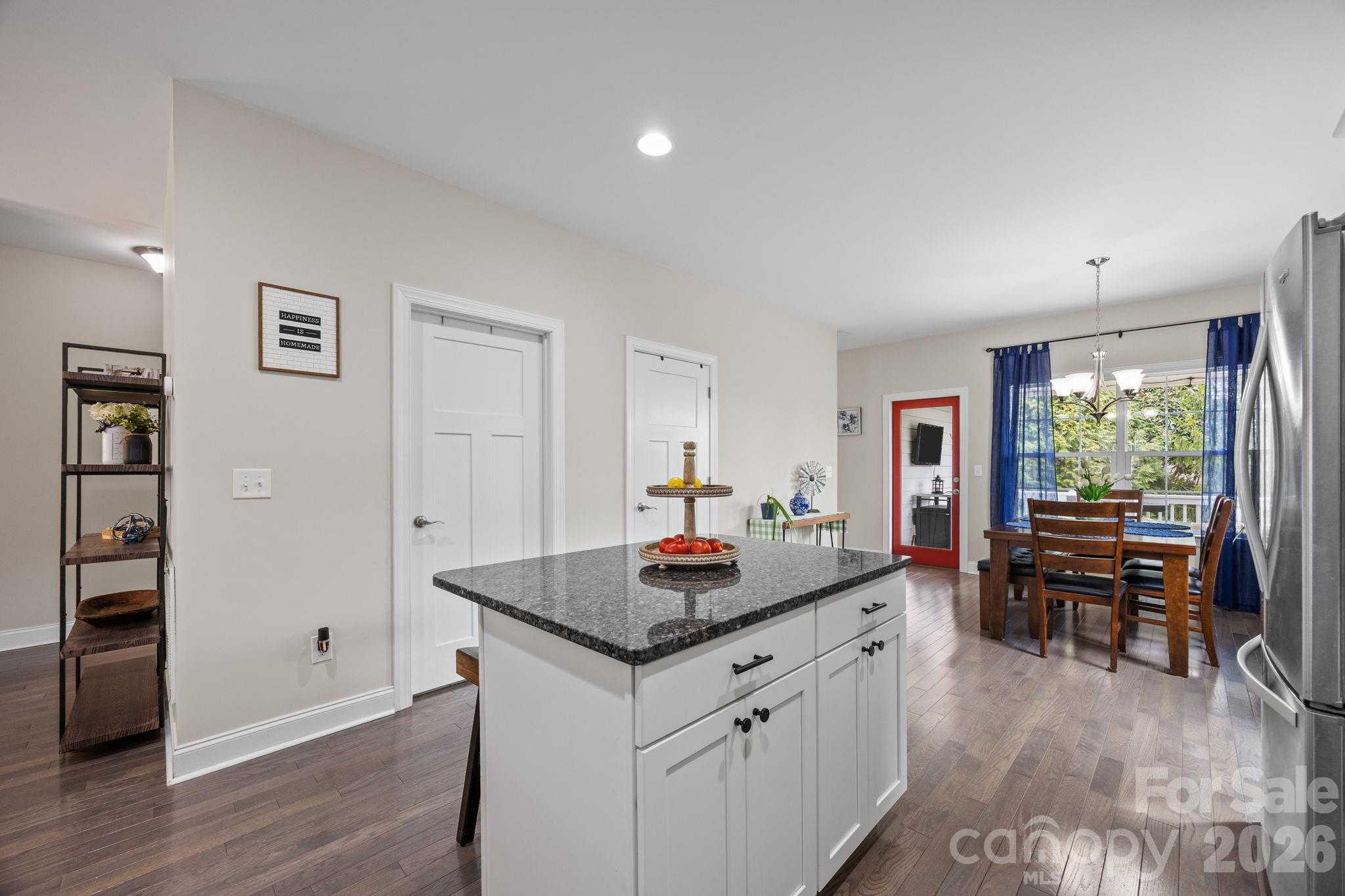 3 Dreambird Road Leicester, NC 28748 - Photo 17 of 48 a kitchen that has a table and chairs in it