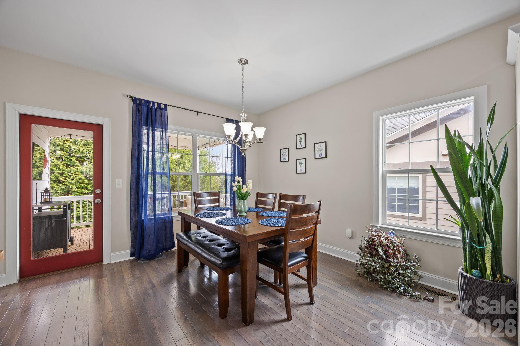 3 Dreambird Road Leicester, NC 28748 - Photo 20 of 48 a view of a dining room with furniture window and wooden floor