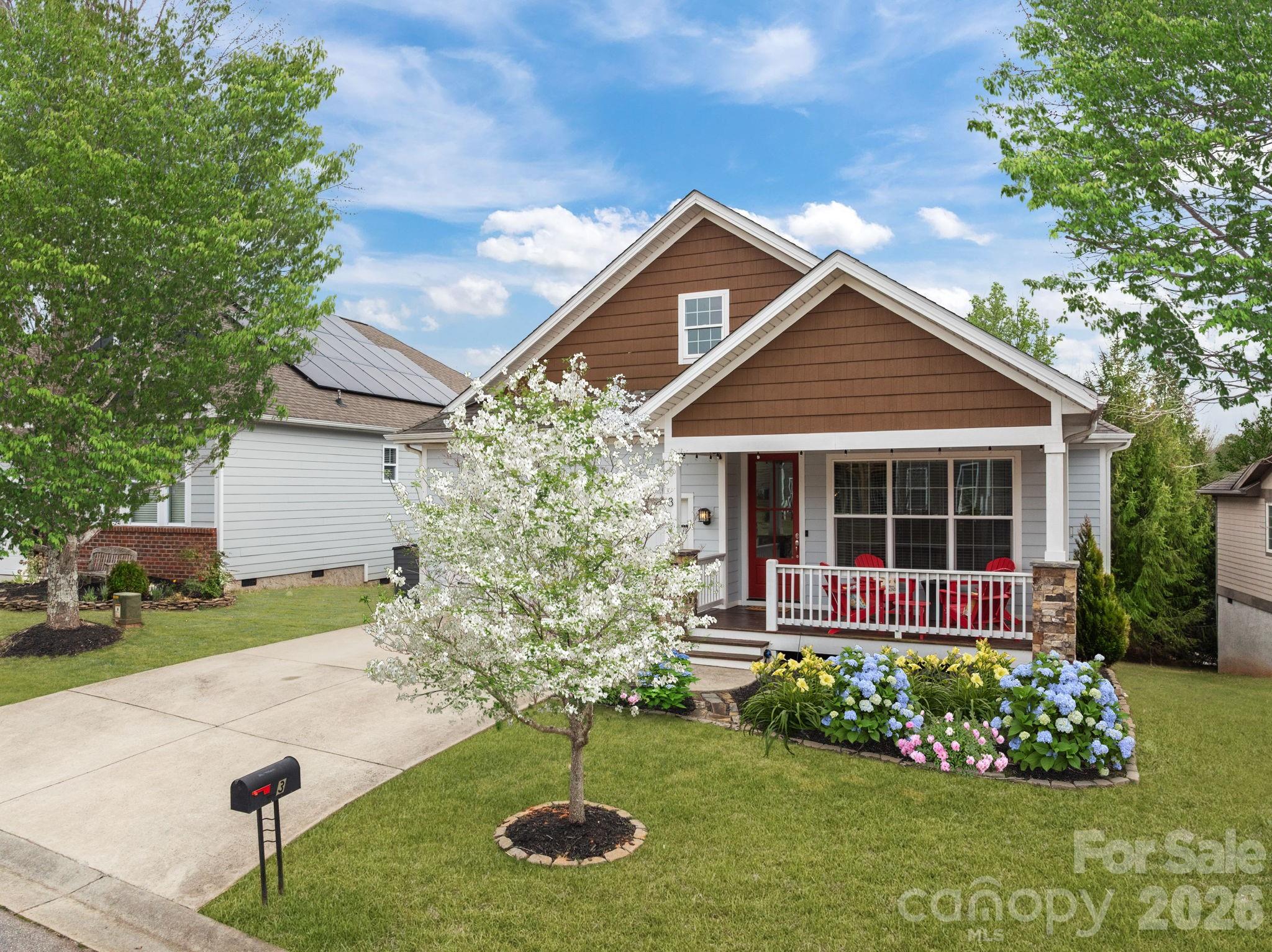 3 Dreambird Road Leicester, NC 28748 - Photo 2 of 48 a front view of a house with garden