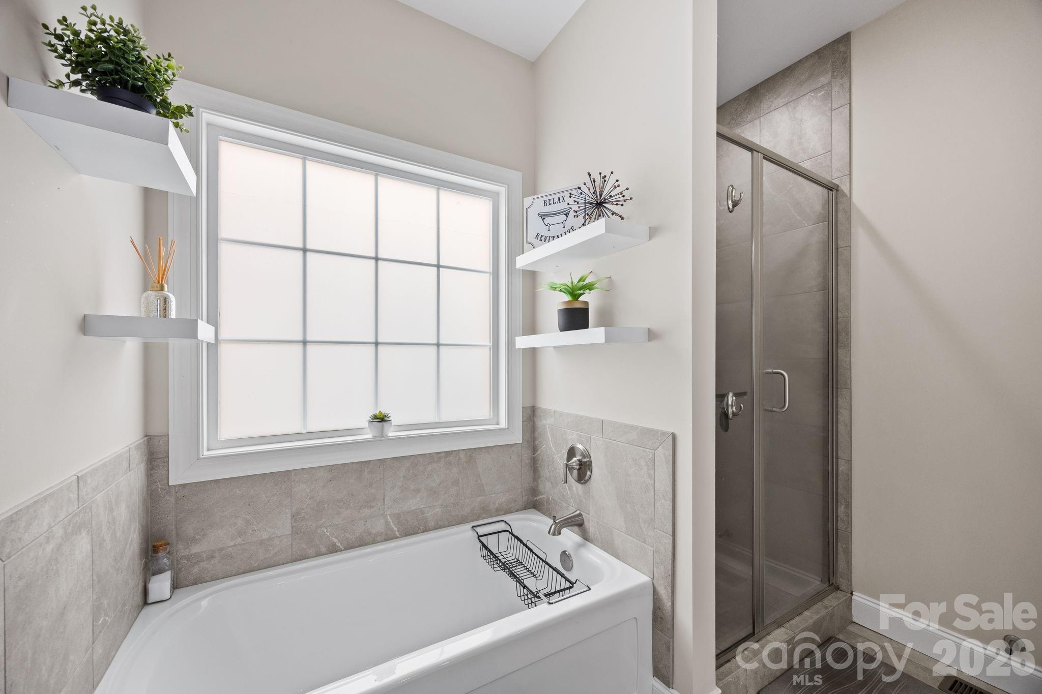 3 Dreambird Road Leicester, NC 28748 - Photo 27 of 48 a bathroom with a bathtub and shower