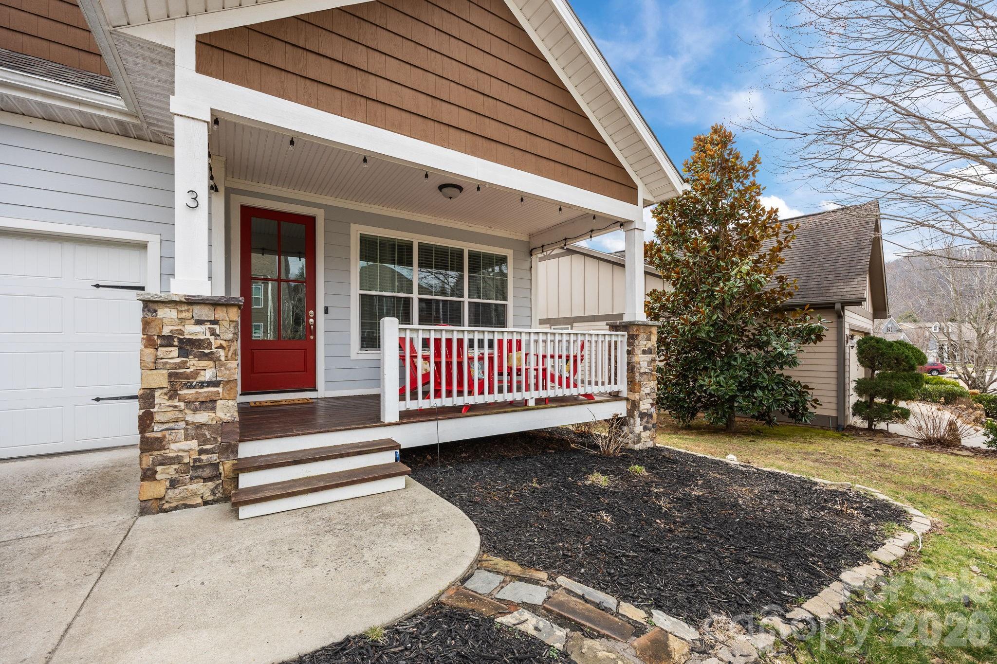 3 Dreambird Road Leicester, NC 28748 - Photo 5 of 48 a view of a porch with a bench in front of house