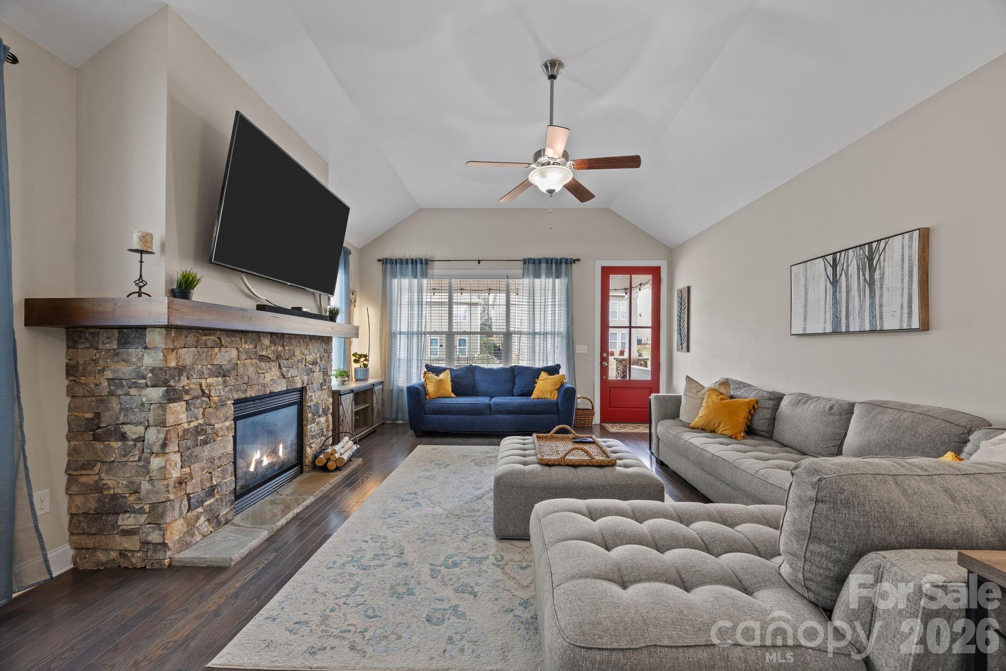3 Dreambird Road Leicester, NC 28748 - Photo 10 of 48 a living room with furniture a flat screen tv and a fireplace