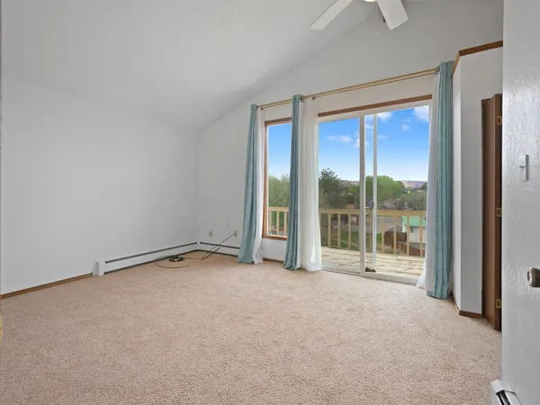 a view of an empty room with a sliding door