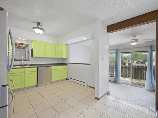 a kitchen with a refrigerator and sink