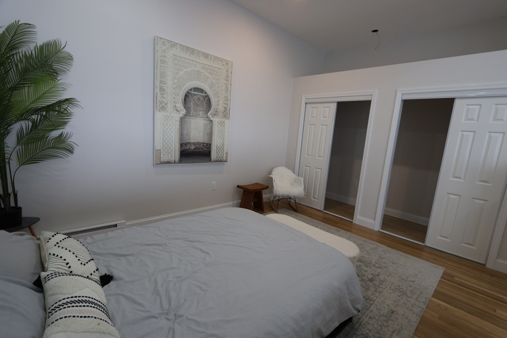 331 Proctor Avenue Revere, MA 02151 - Photo 22 of 29 a bedroom with a bed and a potted plant