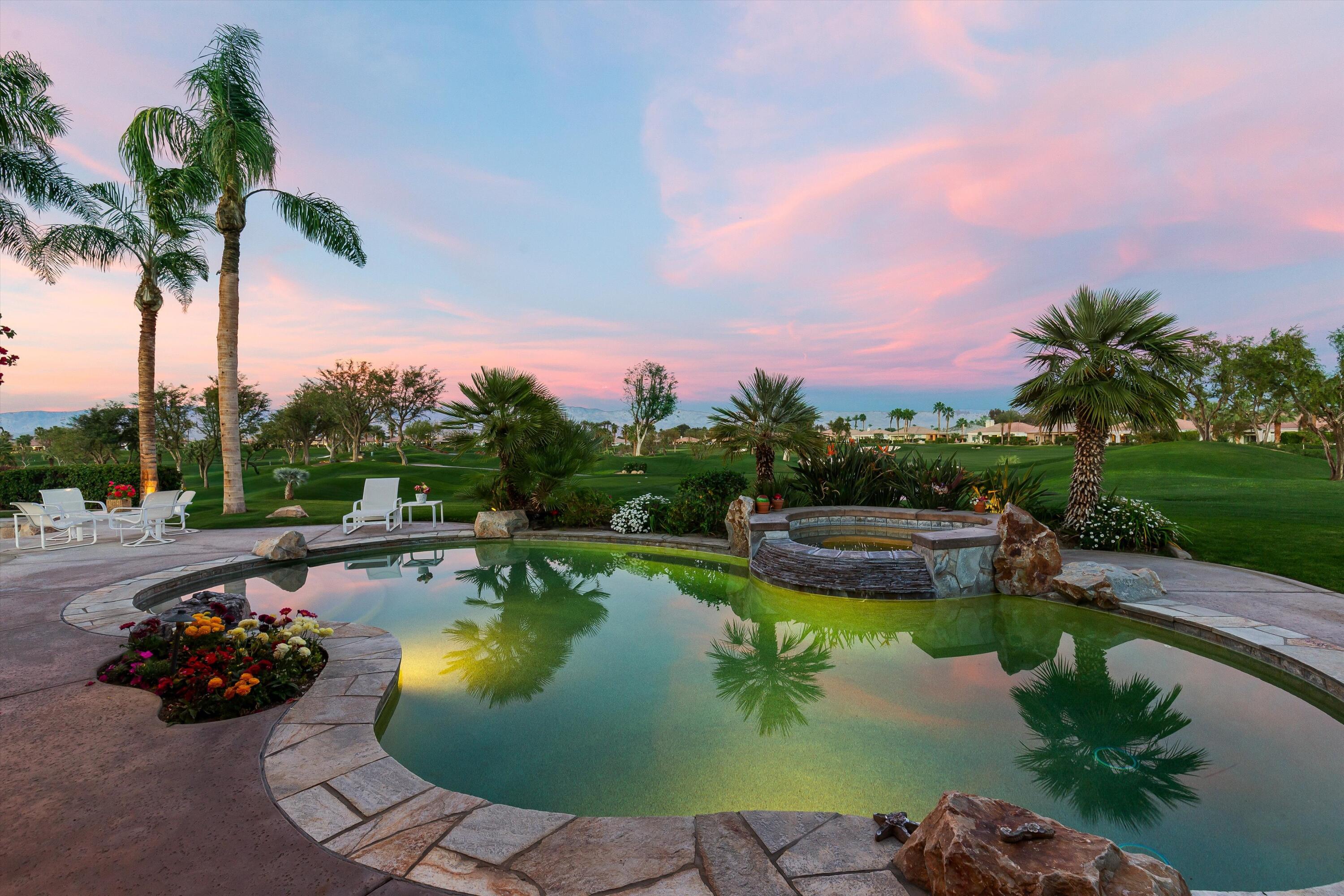 a view of a swimming pool and lounge chair